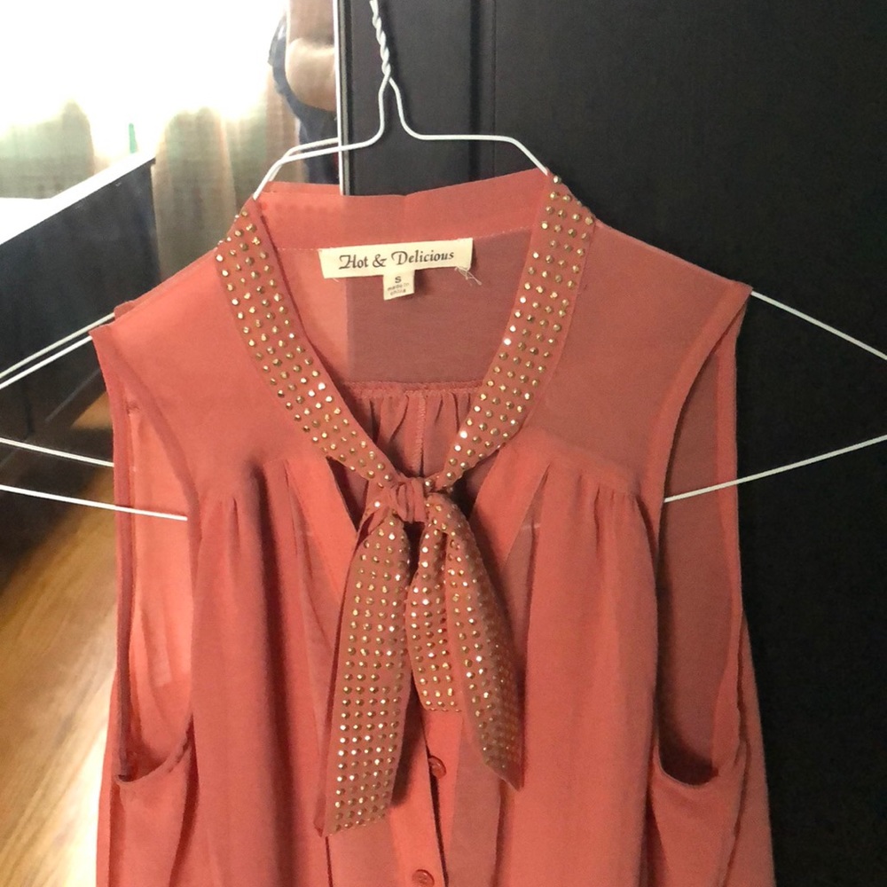 Peach blouse, sequined bow tie on top,